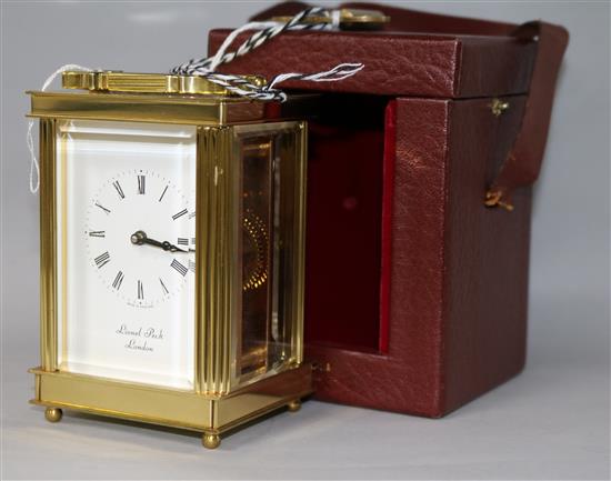 A Lionel Peck of London brass carriage timepiece, with travelling case, 12cm